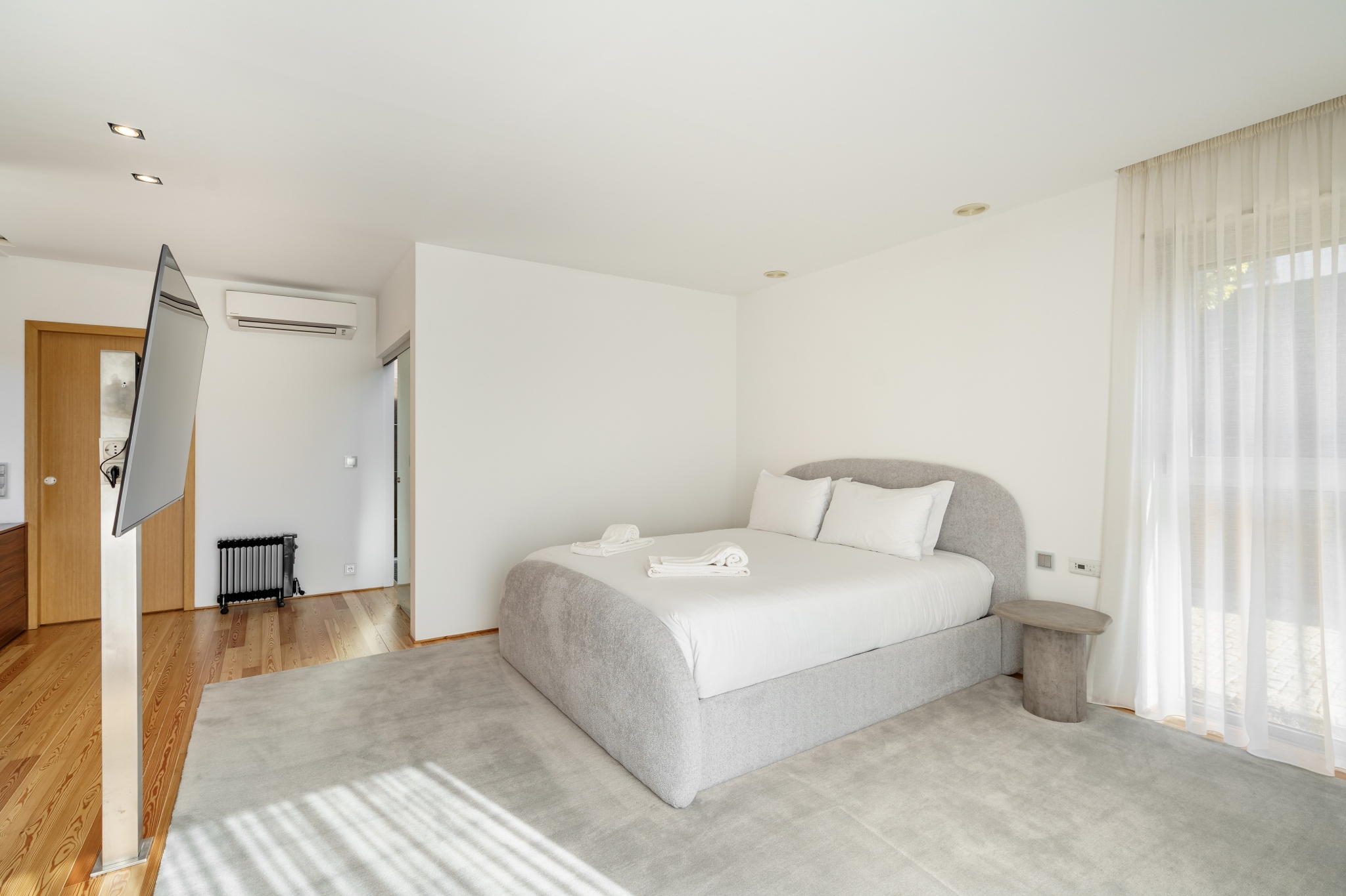 Garden Suite — the bedroom and sitting area in afternoon light.