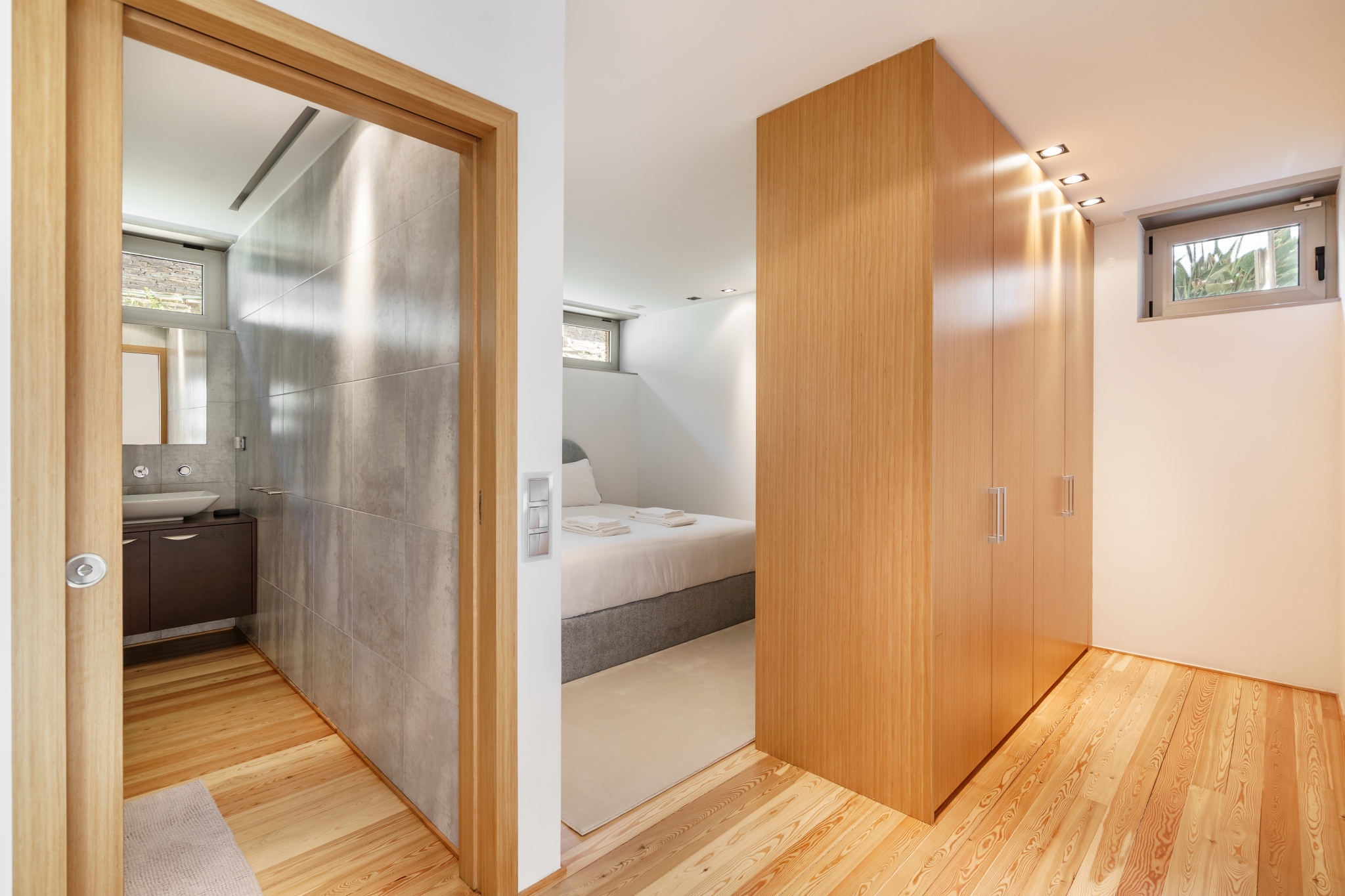 Pool Suite — dressing corridor between the bedroom and ensuite.